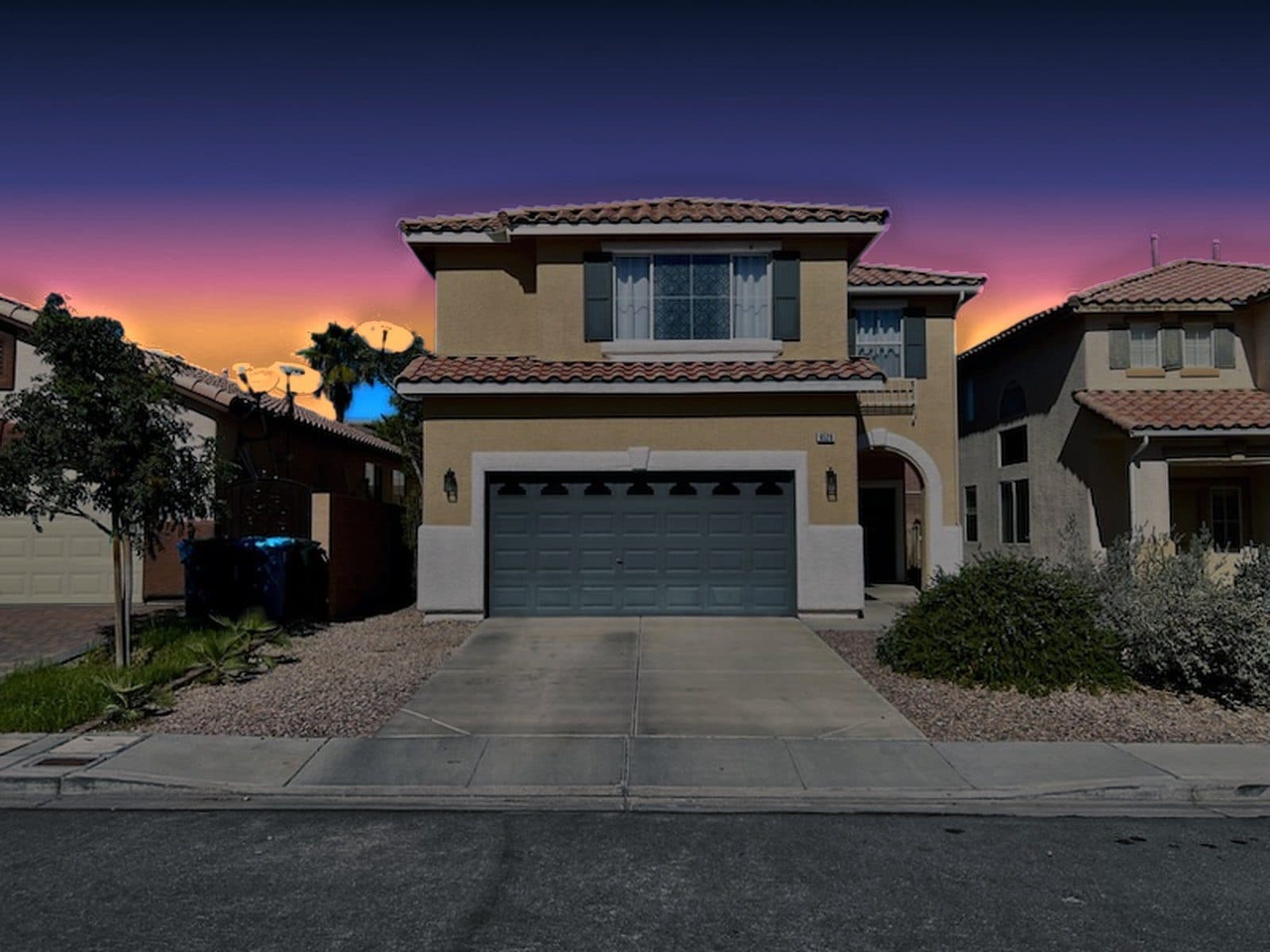 Front exterior of 9528 Rainfall Avenue at twilight (sky digitally edited)